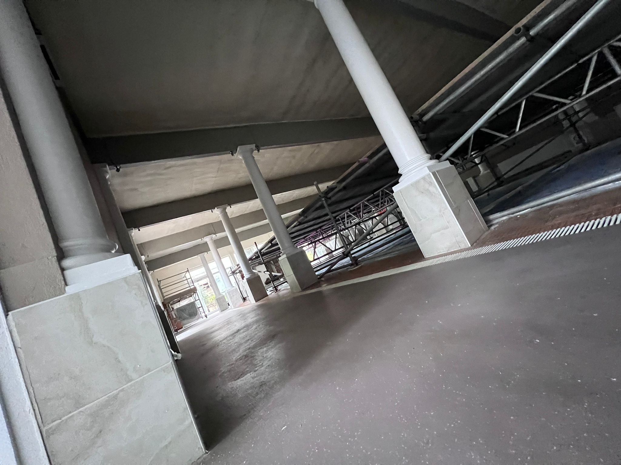 Post-install spray foam showing steel structure in pool hall