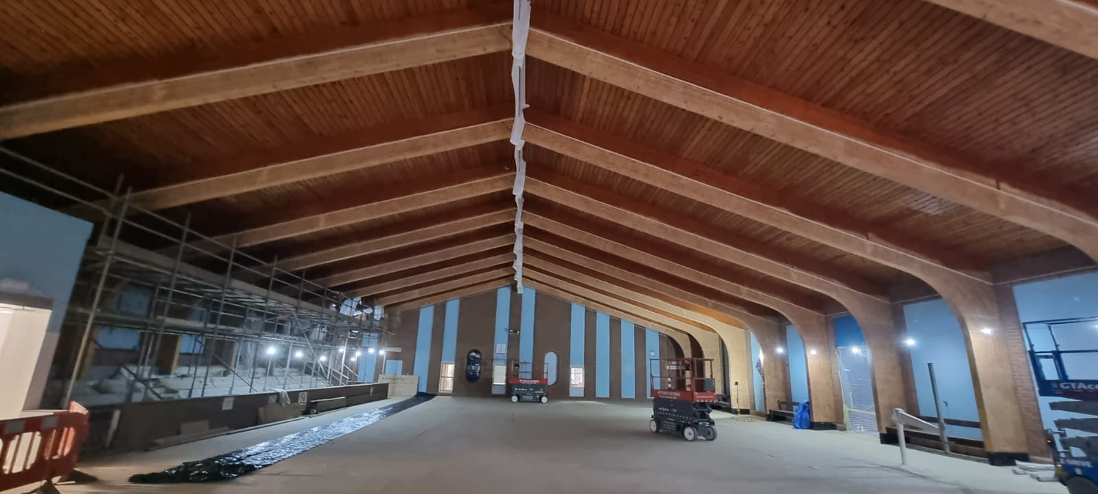 Public pool during installation with timber beams and scaffolding