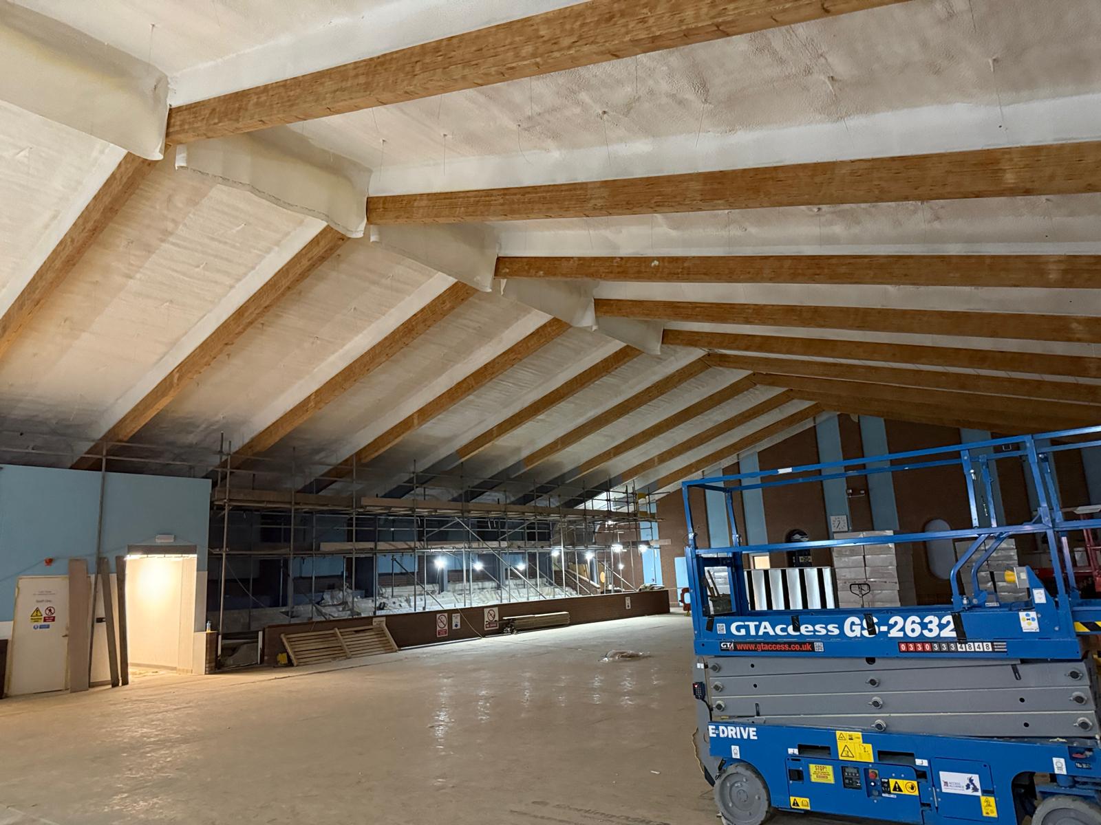 Completed spray foam insulation on pool hall timber roof